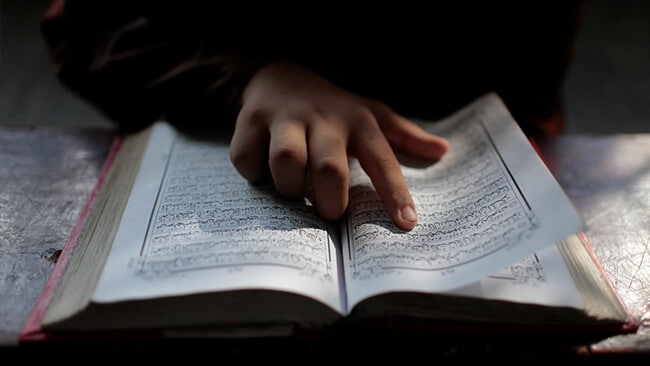 When was the Quran written?